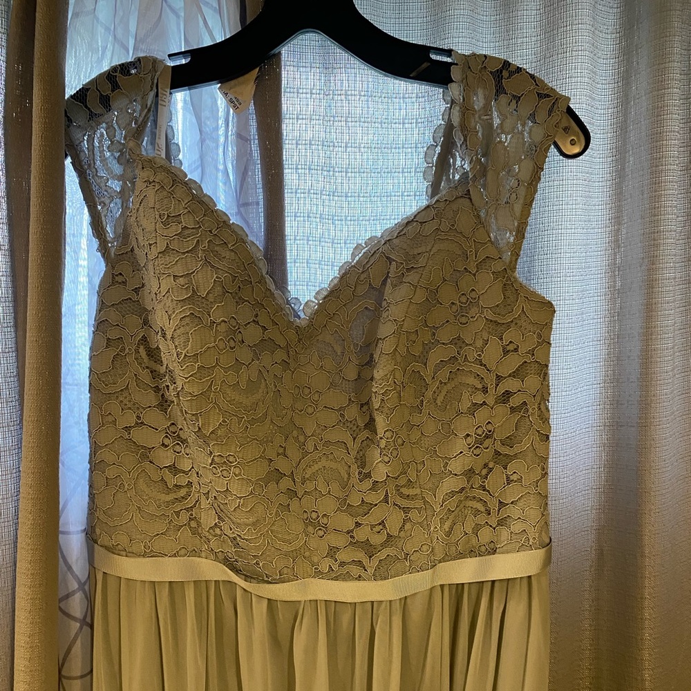 Brand new with tags. Bridesmaid dress. Size 14 color Mystic light silvery gray)